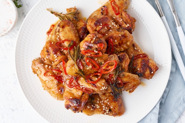 Barbecue chicken wings. Slow cooker sweet and spicy. Oven baked marinated chiken on plate