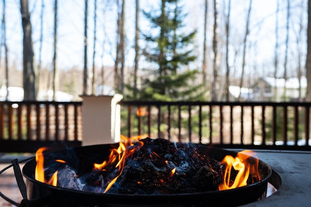 Barbecue grill with fire on open air close up