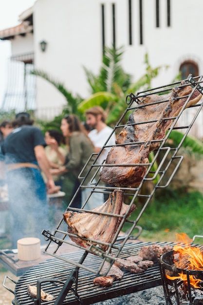 A barbecue grill with a lamb on it