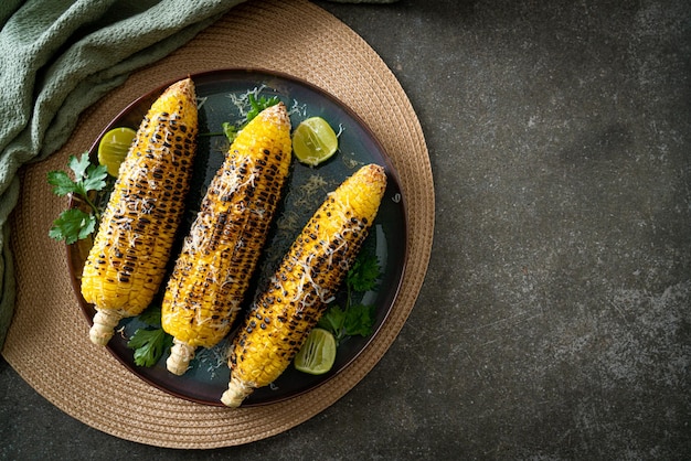 Barbecue and grilled corn with cheese and lime