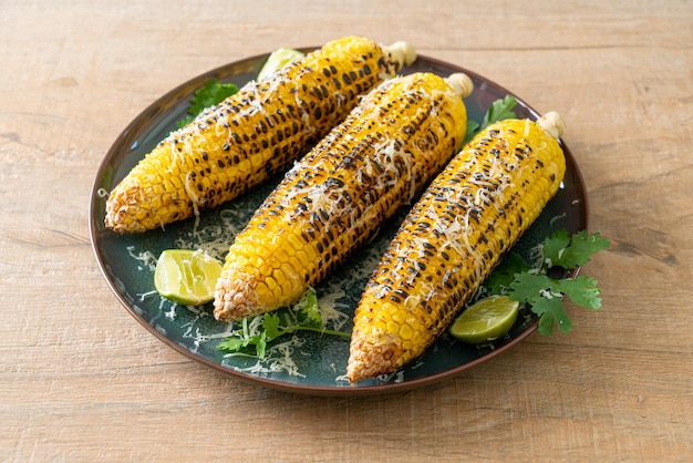 Barbecue and grilled corn with cheese and lime