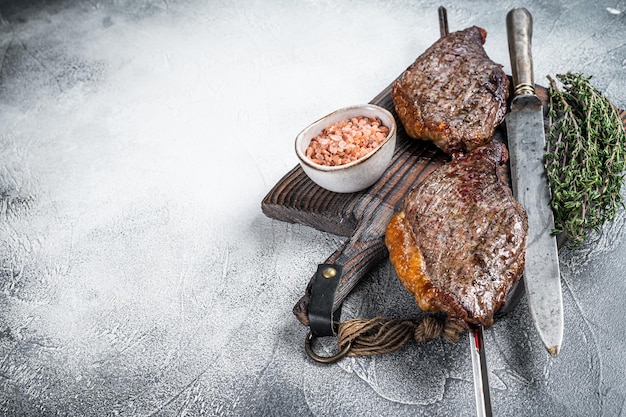 Barbecue grilled dry aged wagyu Brazilian picanha from the sirloin cap beef meat White background Top view Copy space