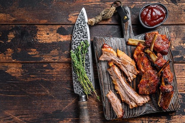 Barbecue grilled sliced veal short spare loin ribs on a cutting board