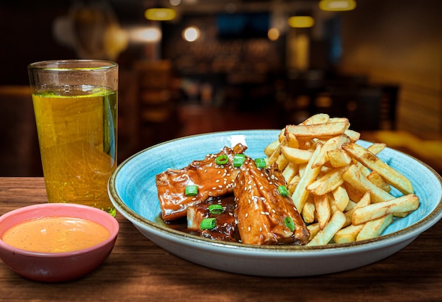 Barbecue pork ribs with french fries and soft drink