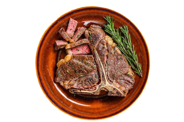 Barbecue Roast porterhouse or t bone beef meat Steak on a rustic plate Isolated on white background