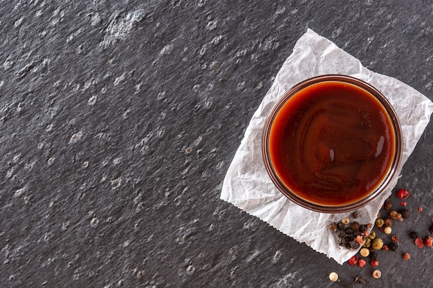 Barbecue sauce on black slate background