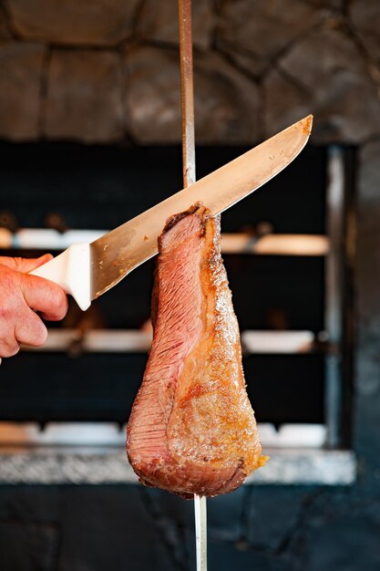 Barbecue on a skewer served in traditional Brazilian steakhouses