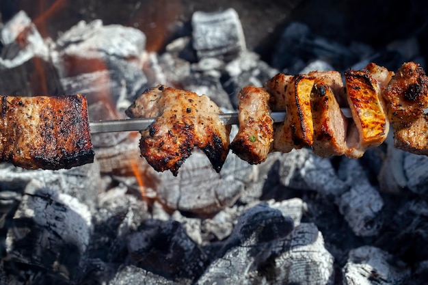 Barbecue with cooking meat on the fire