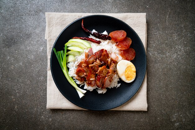 Barbecued red pork in sauce on topped rice