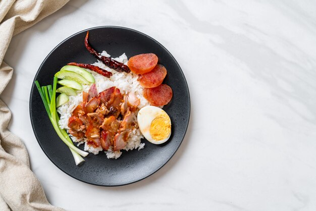 Barbecued red pork in sauce on topped rice