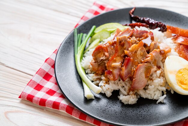 Barbecued red pork in sauce on topped rice