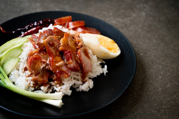 Barbecued red pork in sauce on topped rice