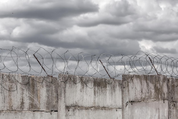 Barbed wire barbed wire on fence with blue sky to feel
worrying