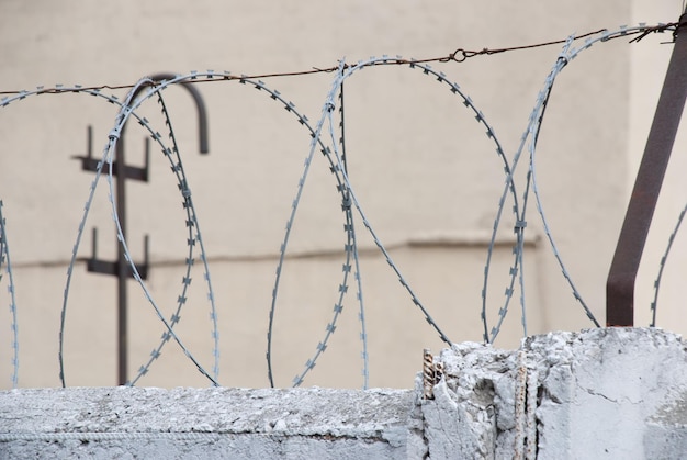 Barbed wire on the top of a fence