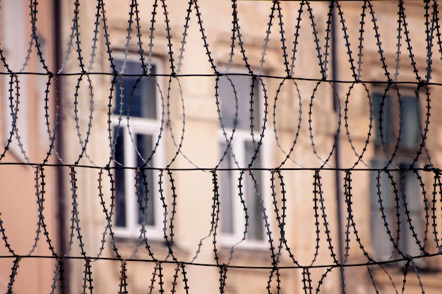 Photo barbed wire and windows of a building