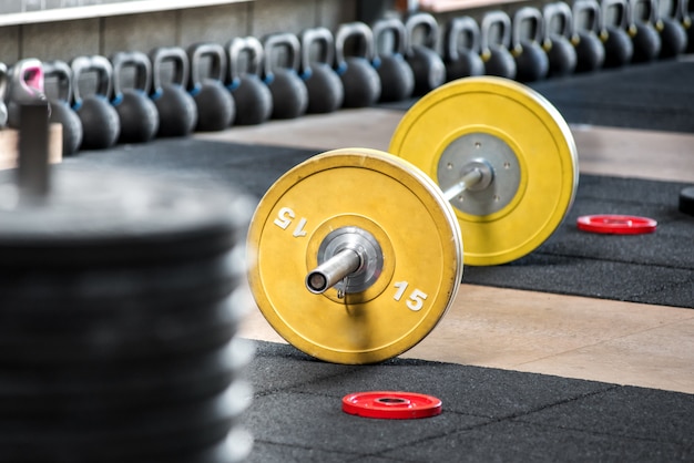 Barbell on the floor in gym