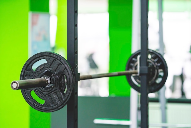 The barbell with a plates in the sport club