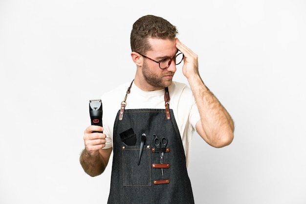 barber man in an apron over isolated white background with headache