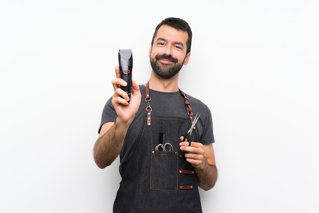 Barber man in an apron over isolated white background