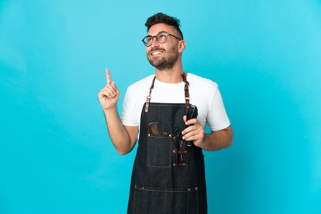 Barber man in an apron pointing up a great idea