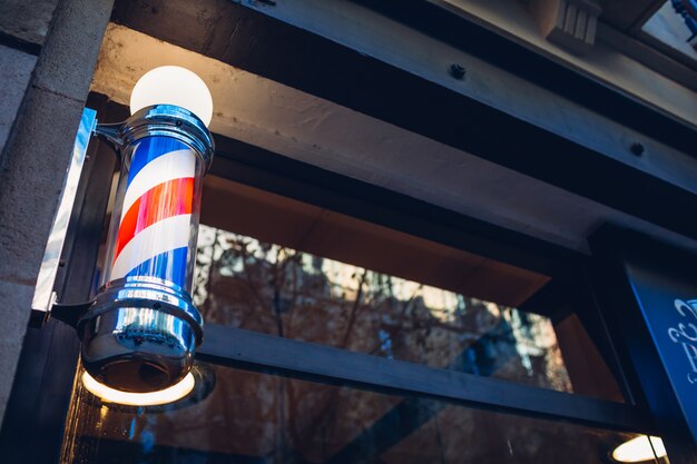 Barber's pole on a barbershop wall