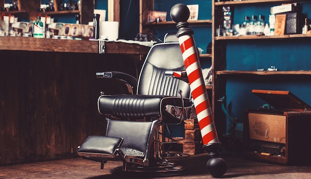 Photo barber shop pole. logo of the barbershop, symbol.