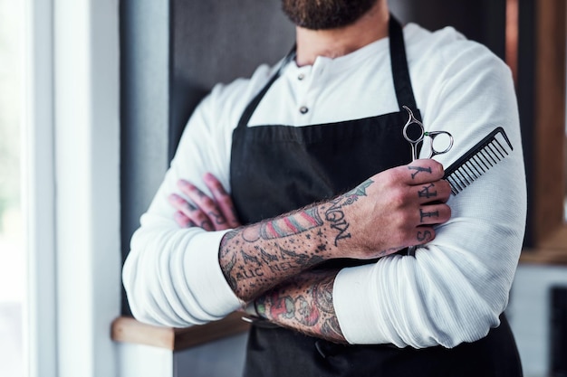 Barber tools and hands of man for hair grooming wellness and hygiene for beard service Small business equipment and person in barbershop hairdresser and parlor for haircare career and styling