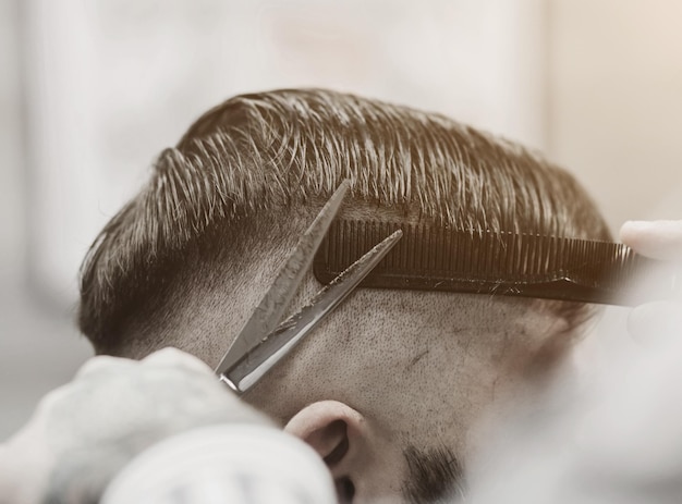 Barber with scissors and a comb