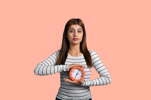 barber women holding clock and looking front indian pakistani model