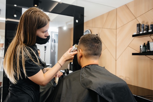 In the barbershop the master cuts and shaves the man