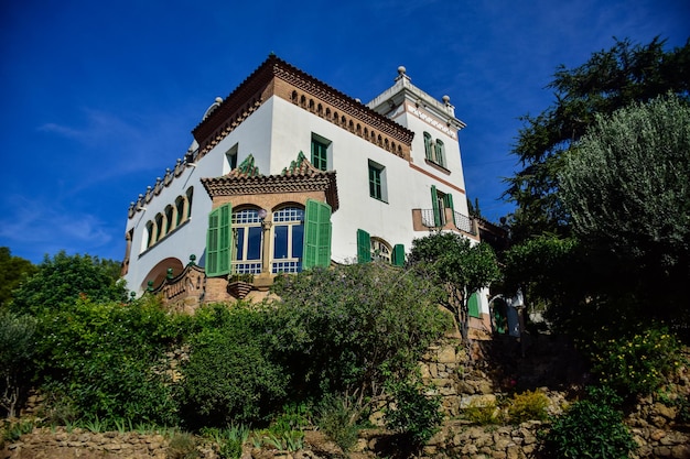 Barcelona Spain October 3 2019 Beautiful white house in Guell Park by architect Gaudi on autumn day in Barcelona Spain