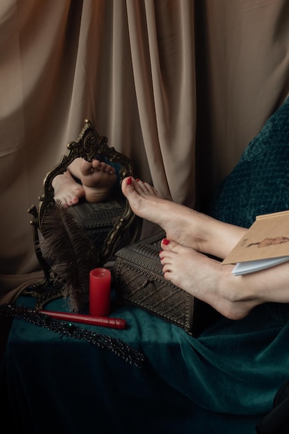 Photo bare feet lying next to vintage items