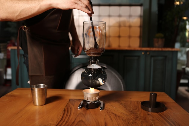 Photo barista brewing coffee in the coffee room