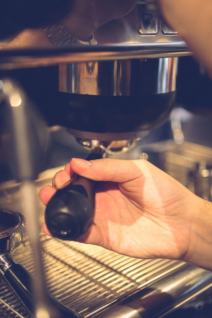 barista brewing coffee in the coffee room