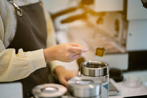 Barista cafe making coffee preparation service concept in restaurant Close up hand barista making f