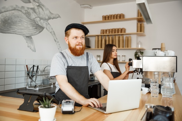 Barista couple working in the coffee shop