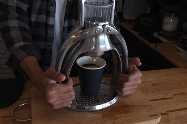 Barista grinding coffee beans