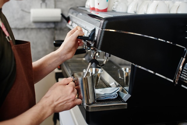 Barista. Hand making the coffee closeup