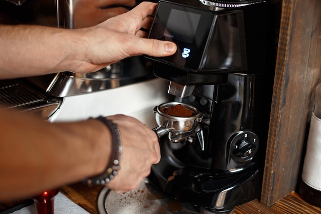 Barista makes coffee ground grain