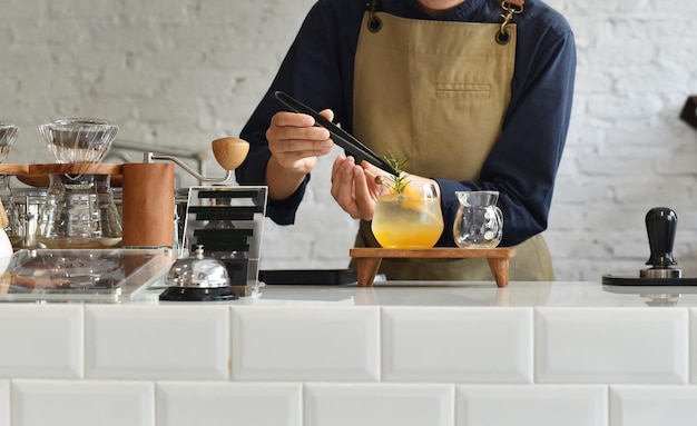 Barista making coffee in cafe