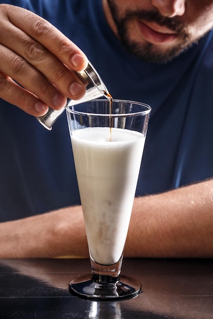 Barista making coffee latte