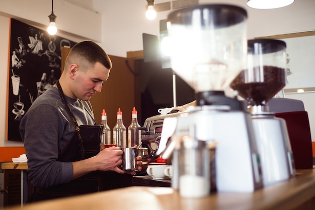 Barista making coffee using a coffee machine