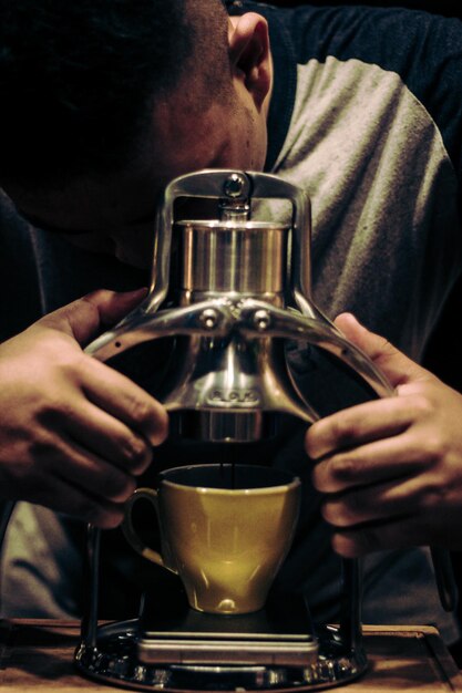 barista making a cup of coffee latte