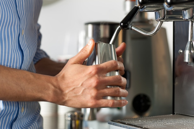 Barista prepares cappuccino