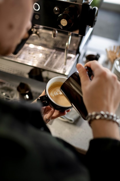 Barista preparing coffee close up