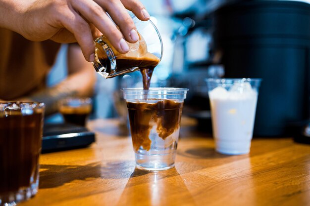 Barista preparing ice americano