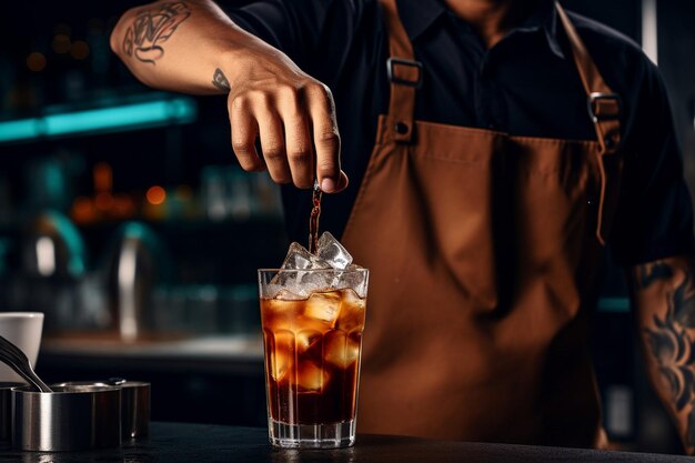 A barista preparing a specialty iced tea latte