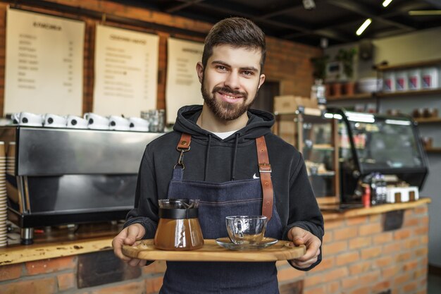Barista with a cup of coffee