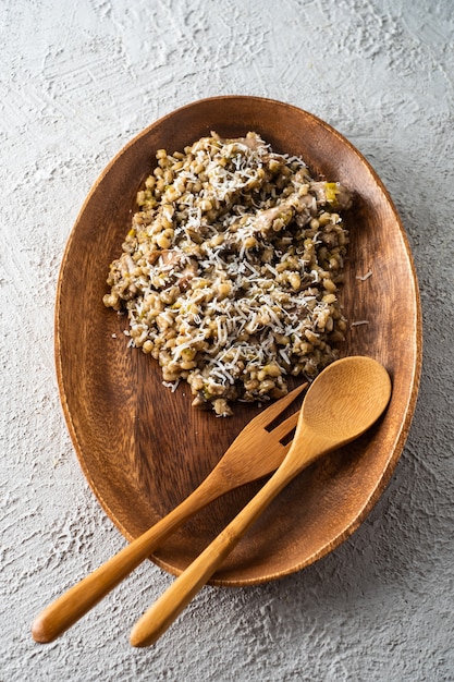 Barley porridge with mushrooms and chicken, top view