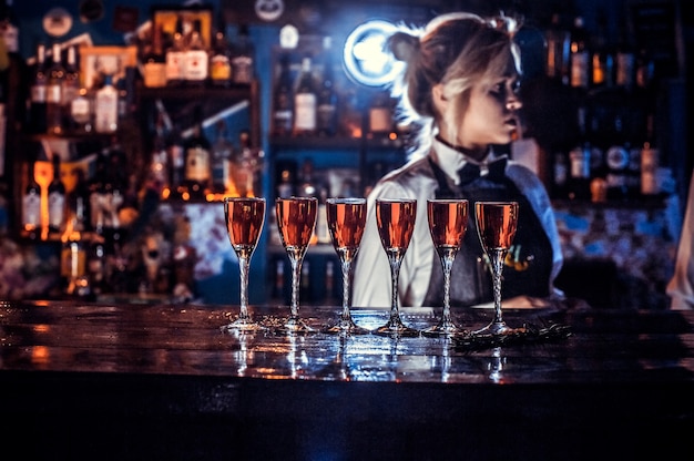 barmaid formulates a cocktail in the beerhouse